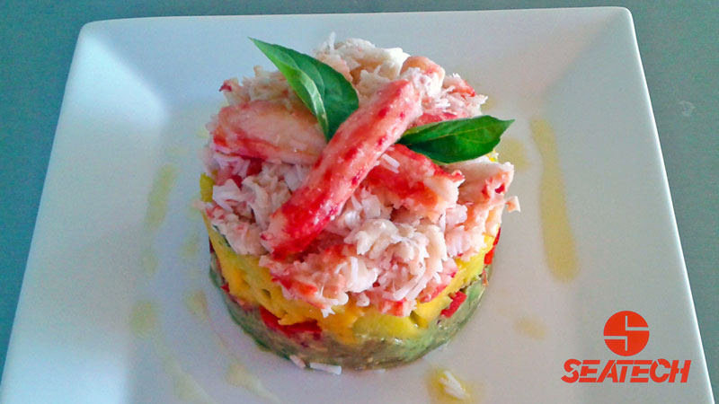 A photograph of a Chilean king crab avocado and mango tower.