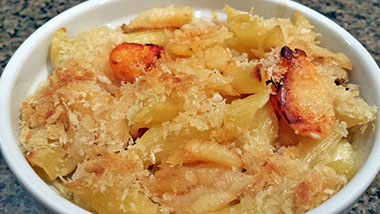 A photograph of freshly made crab meat mac and cheese.